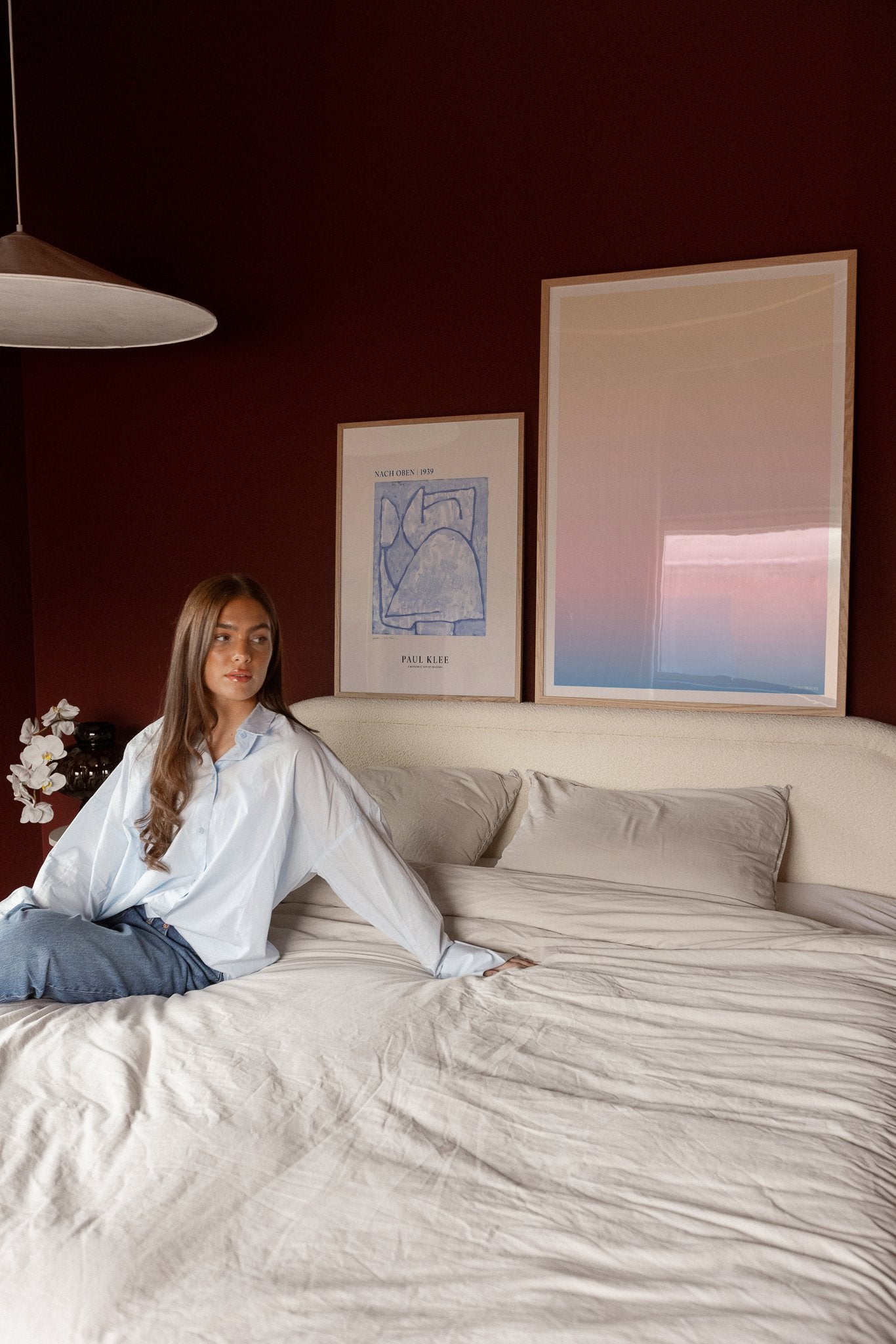 Pastel colored art posters on the headboard